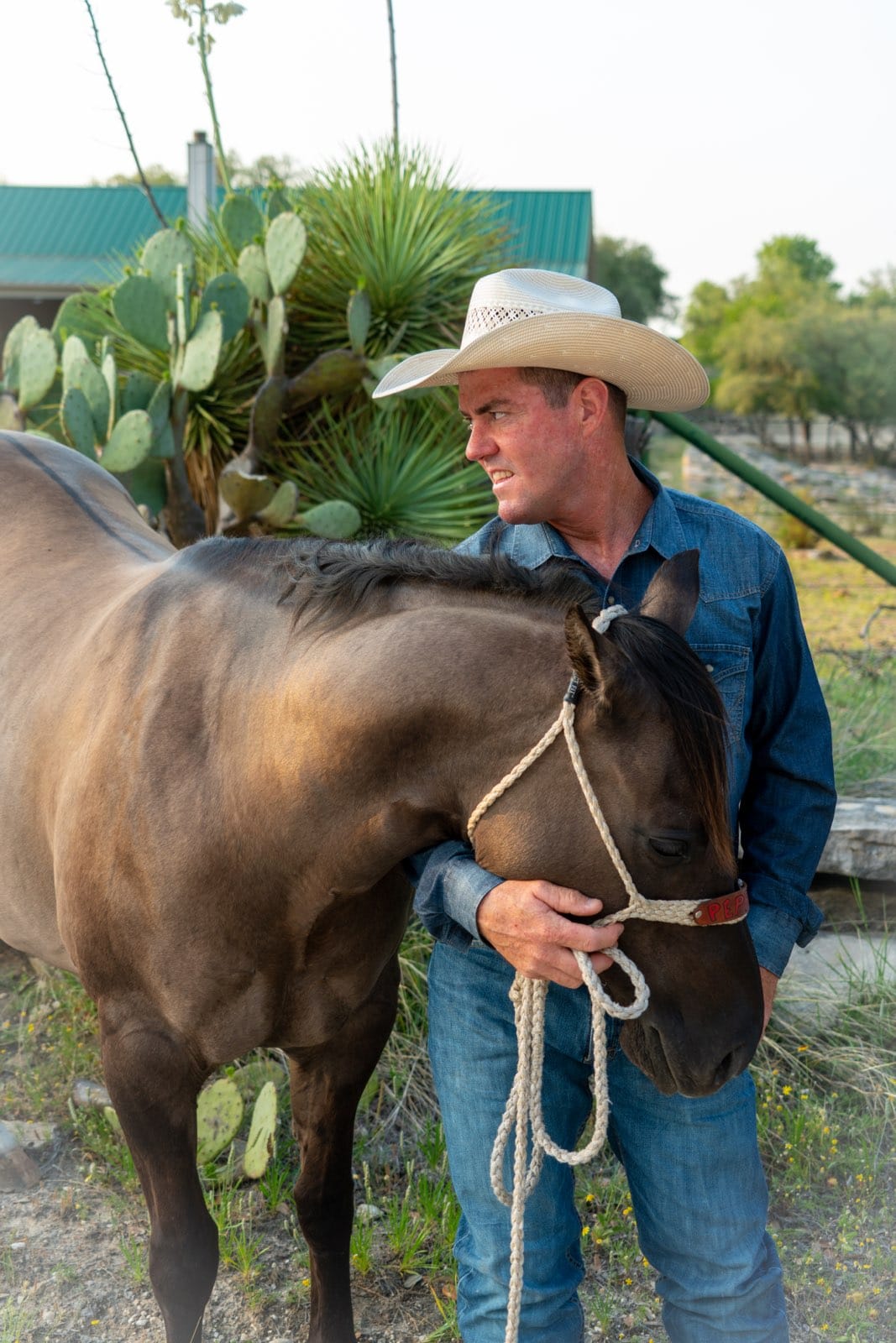 Lance Kelly, owner of All Around Fencing, with his horse on a Granbury, TX area ranch property